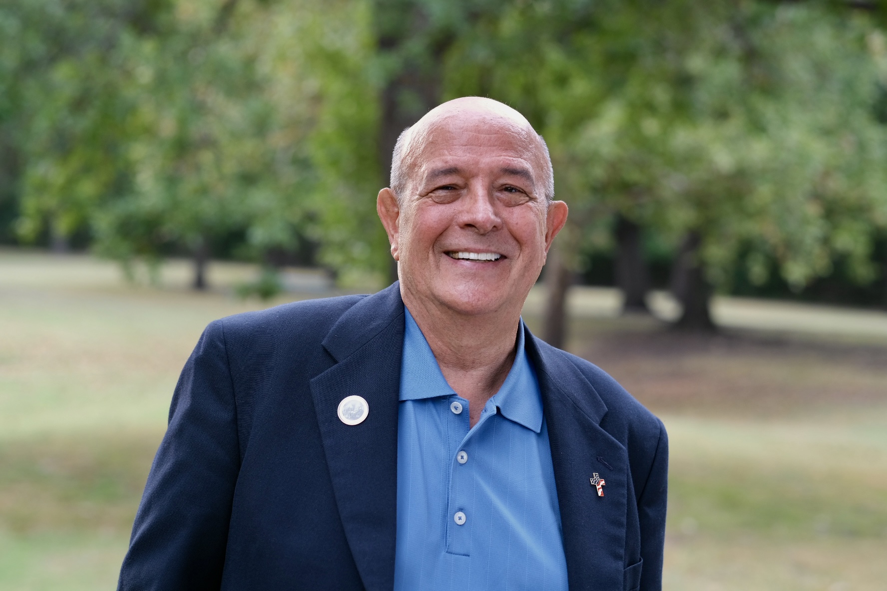Eddie Collins smiling outdoors in Bartlesville